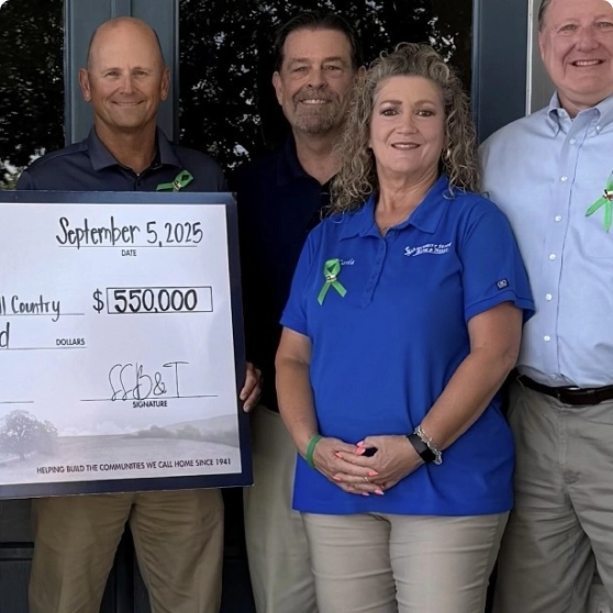 community members holding a check